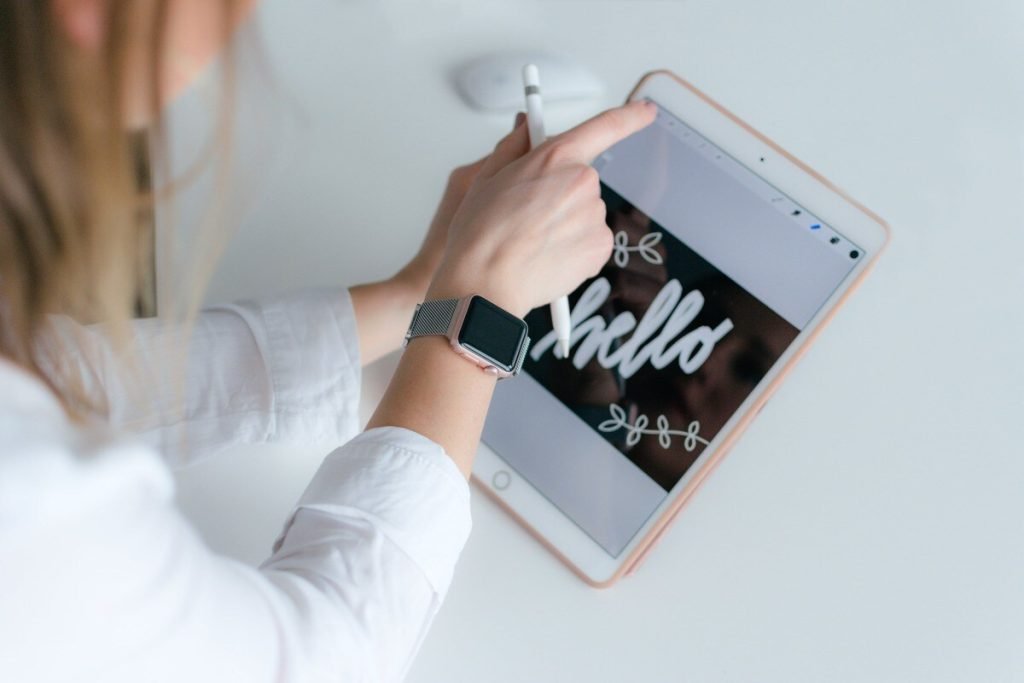 Woman taking notes on her tablet