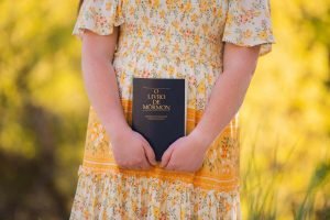 LDS life coach holding a book