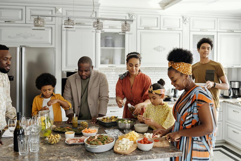 family cooking and eating together