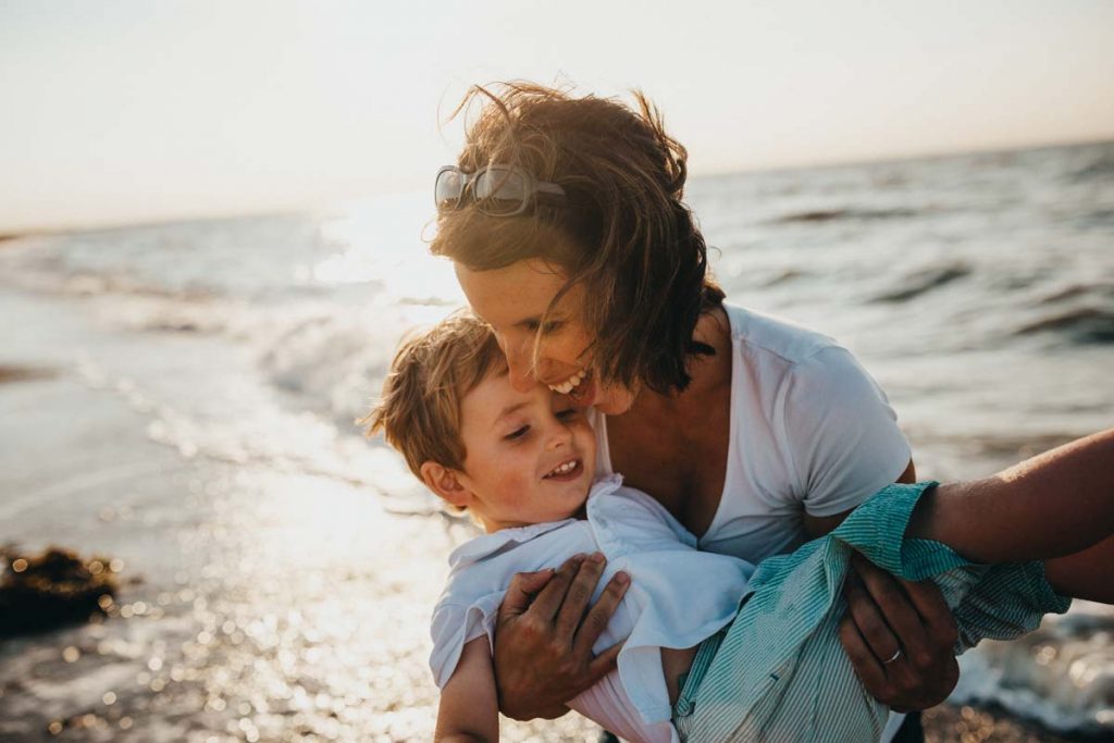 Mother and son on beach - Give yourself permission to be happy