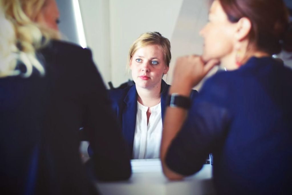 Three businesswomen - Shhh, There Are 140 Million People Waiting to Speak - An Introvert’s Perspective on Coaching