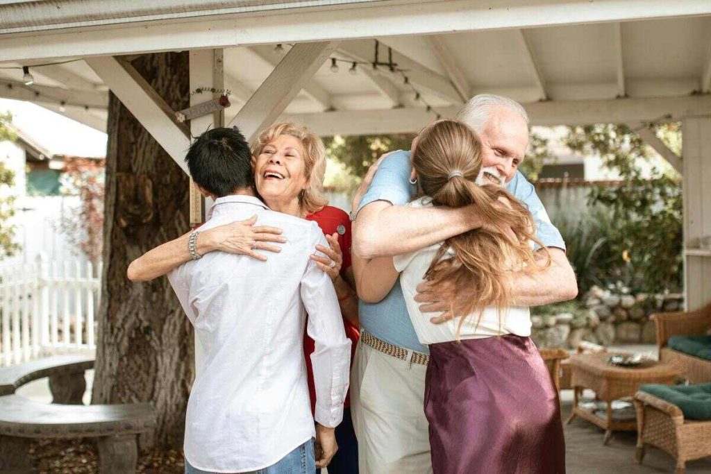 Parents hugging their kids