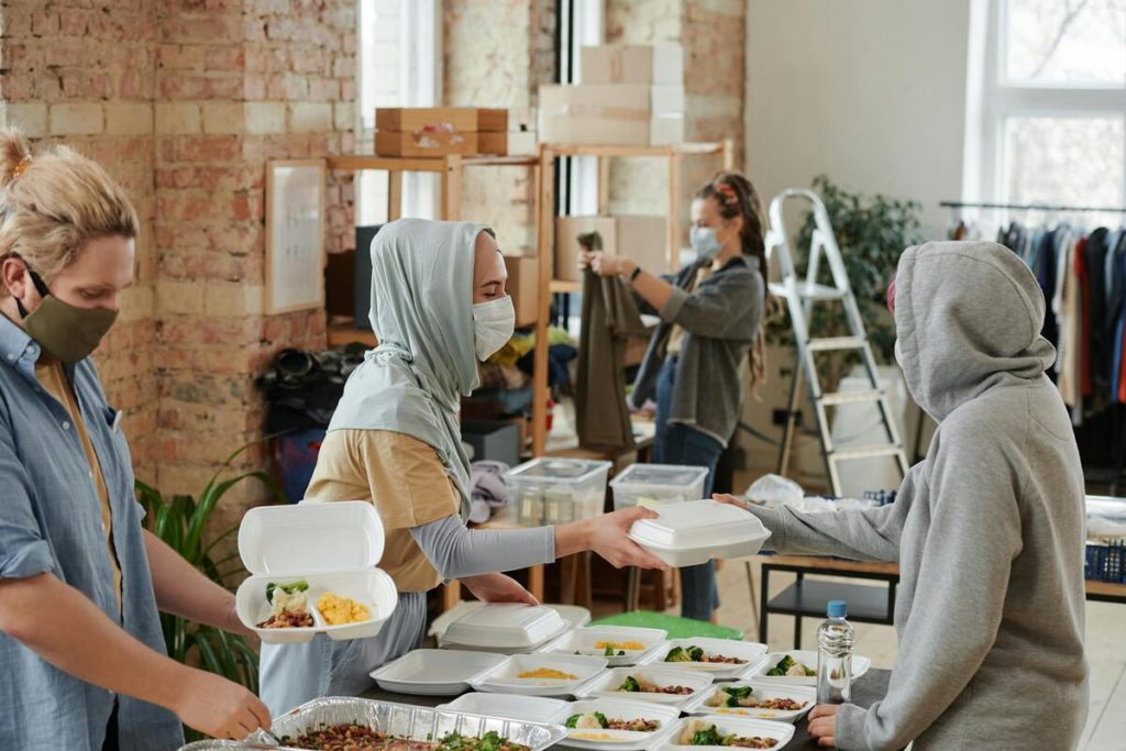 Woman donating food, philanthropy