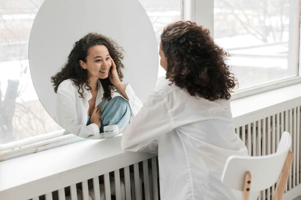 Health Coaching Client Looking at the Mirror